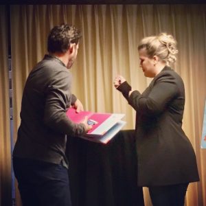 It's a family affair when Clarkson's on the road. That's hubby Brandon Blackstock helping with autographs and photos.